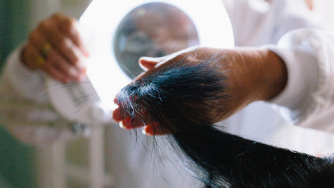 Image of trichologist Eva Proudman examining health of hair